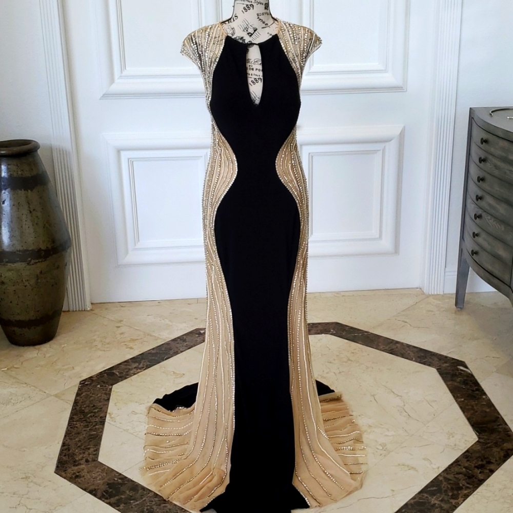 Jovani formal Gown Size 8.  Worn once  black  nude